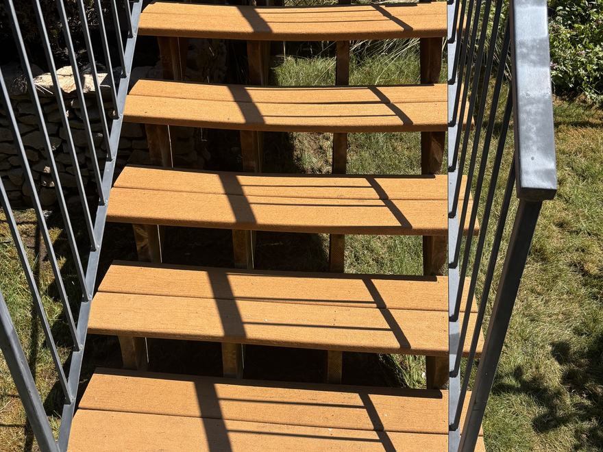 The same deck stairs after a gentle wash, with the wood colour restored