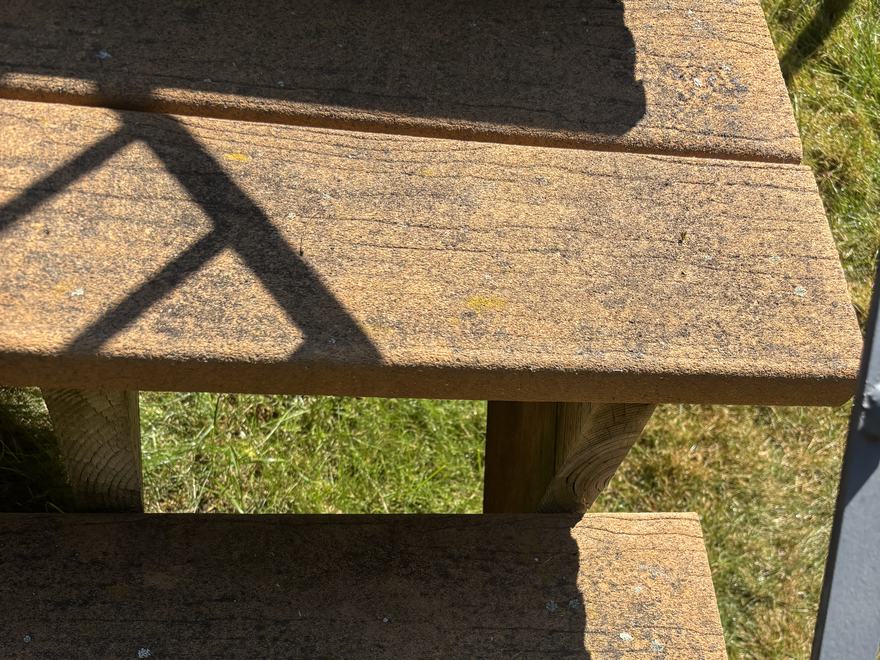Weathered grey deck stairs before cleaning